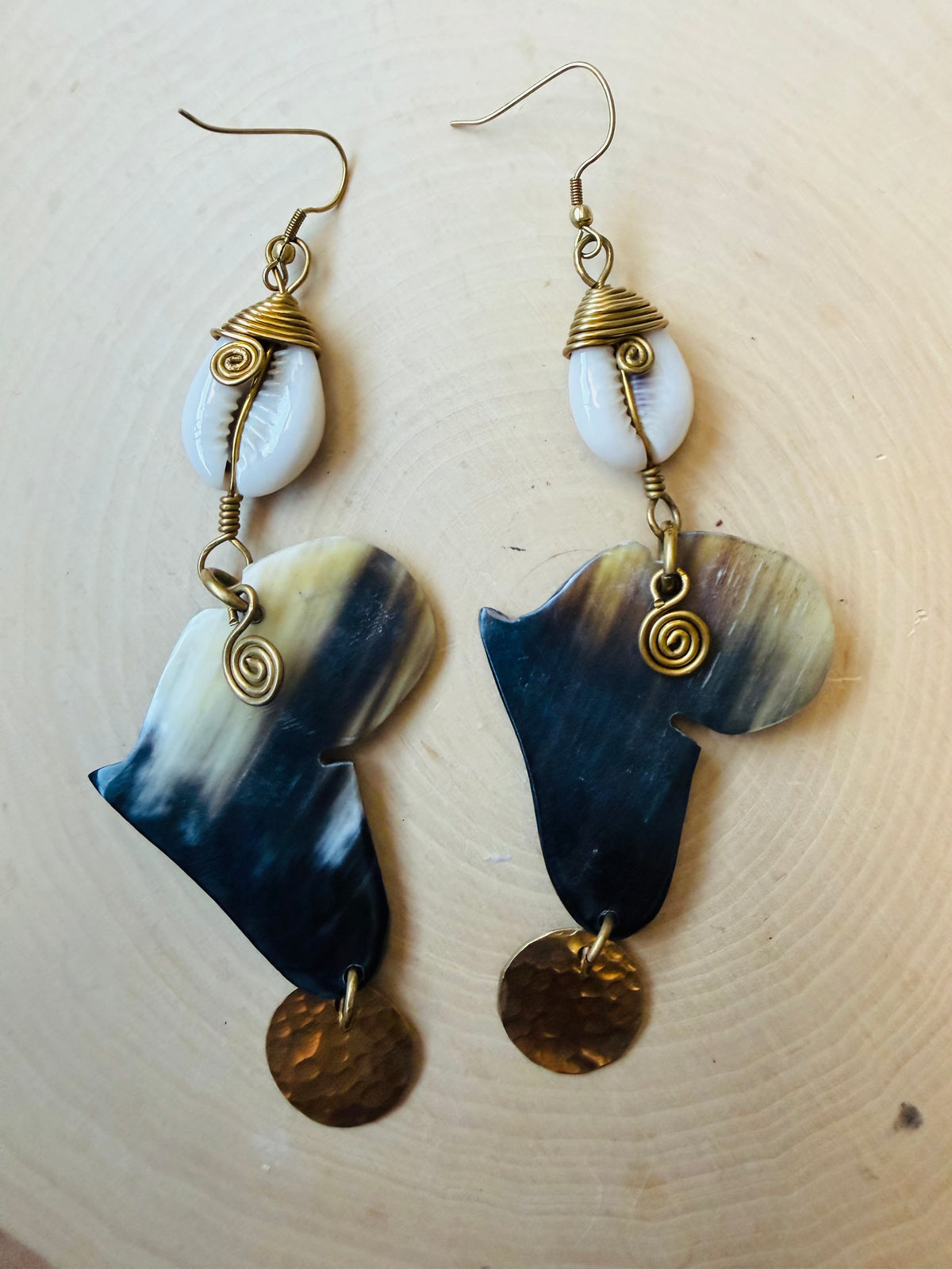 Africa cut out cowrie earrings