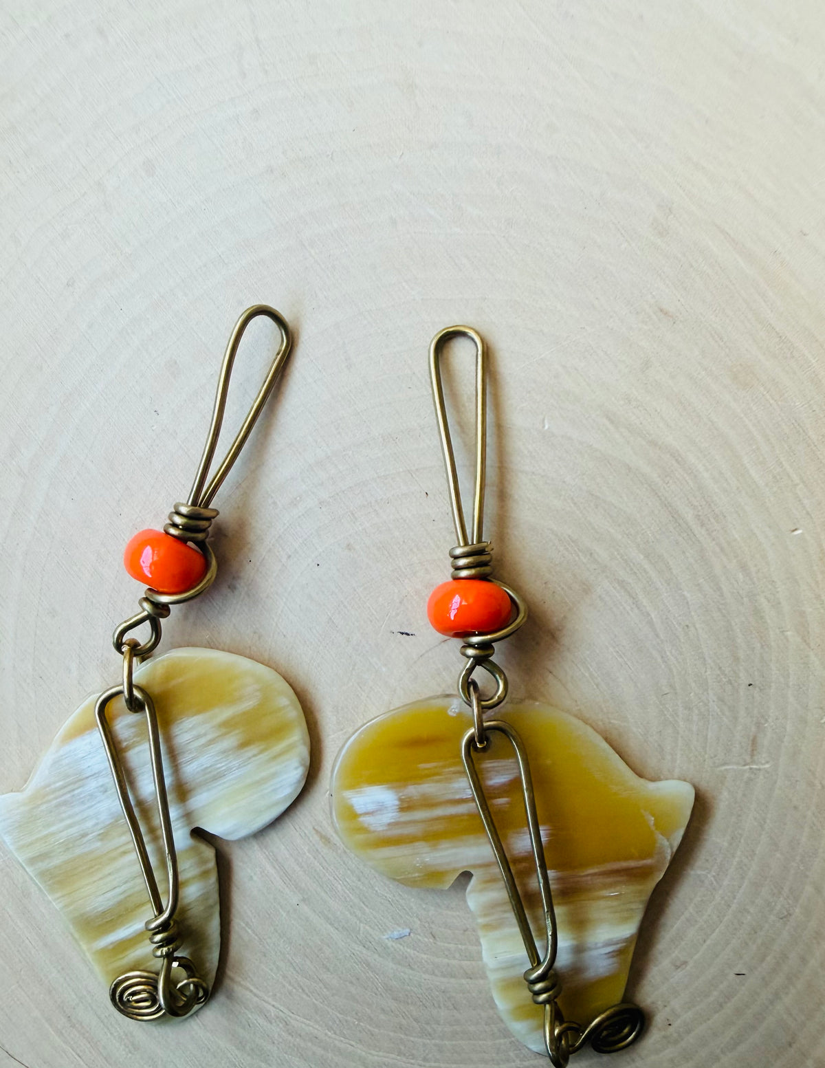 Africa shaped orange beaded earrings