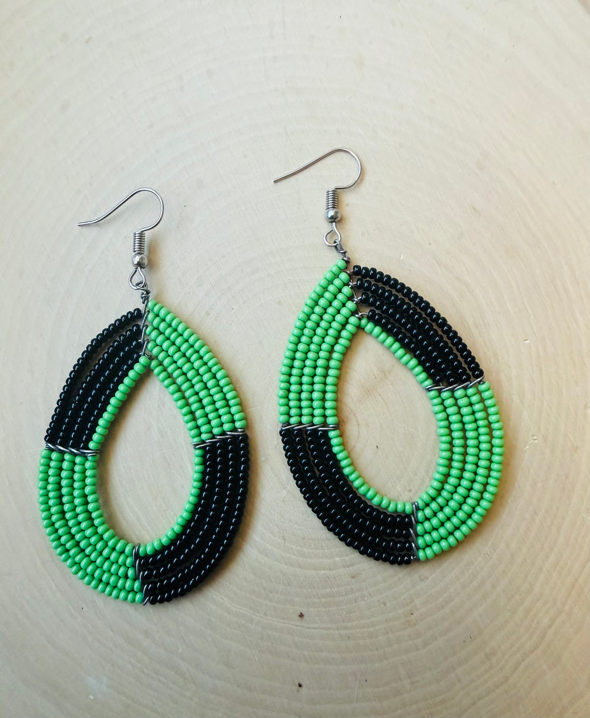 Green and black oval beaded earrings
