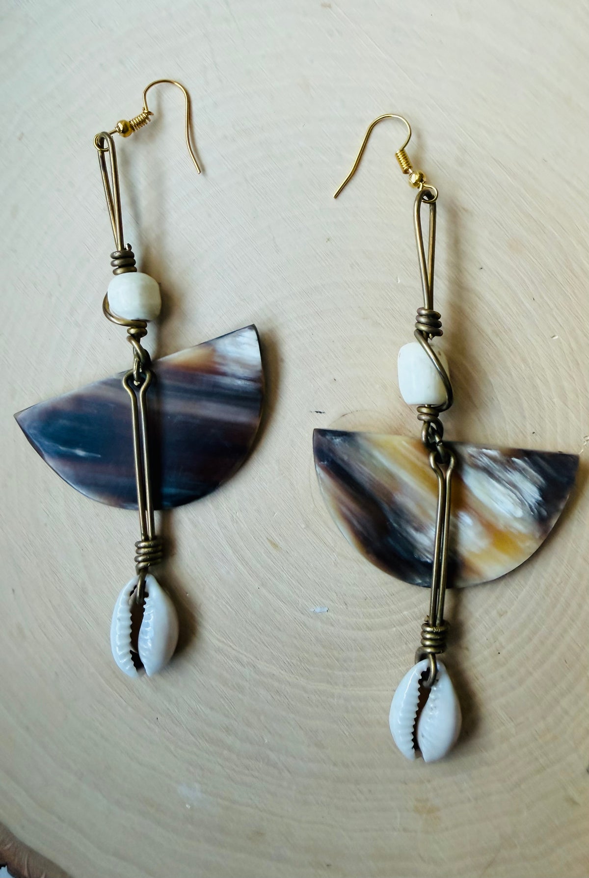Jupiter rising cowrie earrings