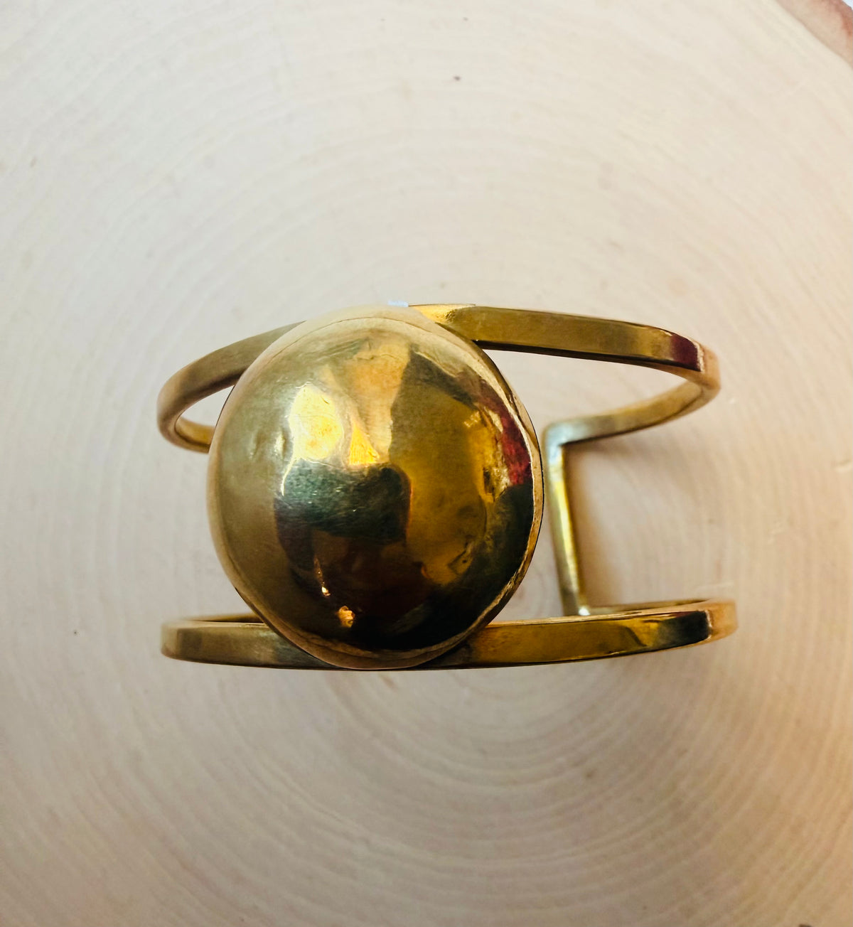 Gold cuff bracelet with circle